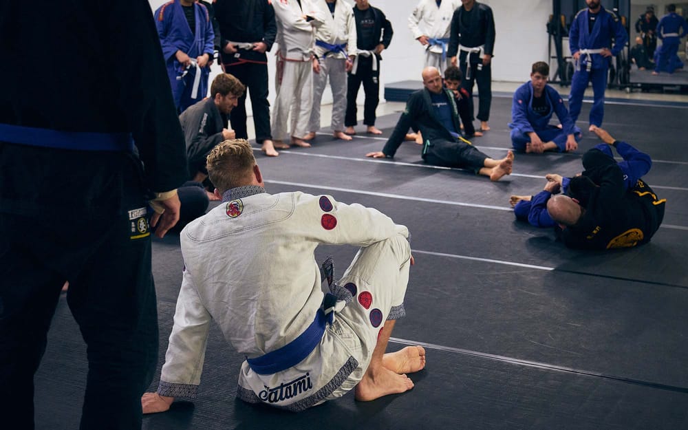 Members rolling together during an open mat session